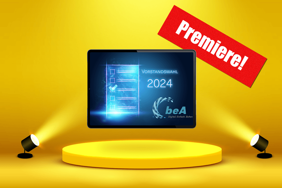 Logo Wahl2024 mit beA und "Premiere" auf Tabletbildschirm auf gelber Bühne im Spotlight